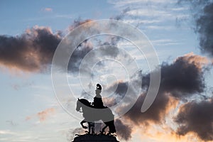 the famous horse man at the commerce square in Lisbon portugal on sunset background