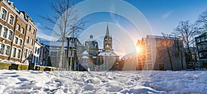 The famous Huge gothic cathedral of The Emperor Karl in Aachen Germany during winter season with snow at Katschhof against blue