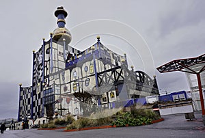 Famous Hundertwasser architecture building Spittelau trash incineration factory in a cloudy day