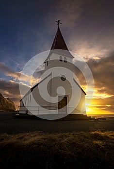 The famous icelandic church at sunrise in Vik y Myrdal, Iceland