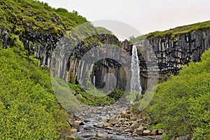 Famous Icelandic Svartifoss waterfall in the basalt & x28;whinstone& x29; canyon placed in VatnajÃ¶kull National Park