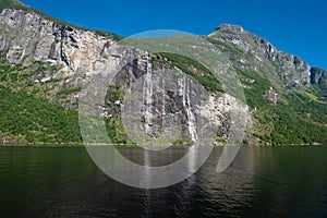 The famous and impressive Seven Sisters Dei sju systre  waterfall dropping 250 meters from a cliff in the Geiranger Fjord