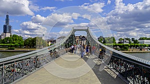 Famous Iron Bridge for pedestrians called Eiserner Steg in the city of Frankfurt - FRANKFURT, GERMANY - JULY 12, 2022