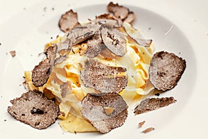 famous Italian delicacy is pasta with truffles. Dish of the day from the chef