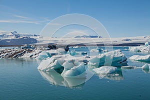 Famous Jökulsárlón Glacier Lagoon in Iceland with several huge ice floes floating on the water