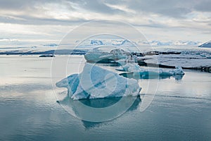 Famous Jökulsárlón Glacier Lagoon in Iceland with several huge ice floes floating on the water