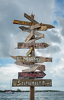 Famous Key West habour sign post with distances to major cities aka Selfiemost Point