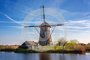 Famous Kinderdijk village of mills, popular tourist attraction in Netherlands Holland, outdoor travel background