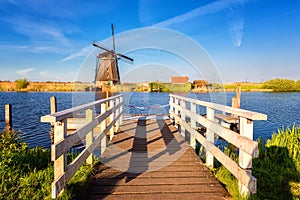 Famous Kinderdijk village of mills, popular tourist attraction in Netherlands Holland, outdoor travel background