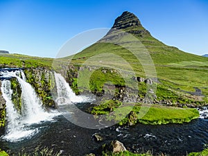 The famous kirkjufellsfoss waterfall with kirkjufell mountain