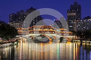 Famous landmark of Chengdu - Anshun bridge over Jin River illuminated at night