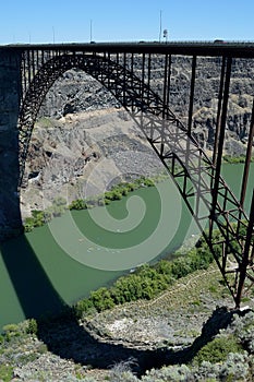 Famous landmark I. B. Perrine Memorial Bridge shadow and kayaks Twin Falls Idaho vertical