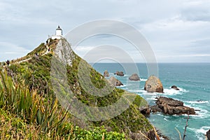 Famous landscape and lighthouse at Nugget Point, New Zealand