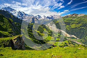 Famous Lauterbrunnen valley with gorgeous waterfall and Swiss Alps