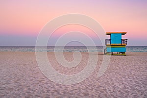 Lifeguard tower at South Beach in Miami with a beautiful sunset sky