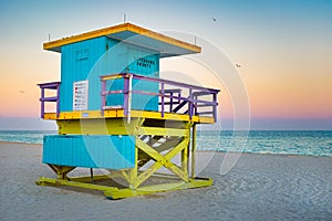 Famous lifeguard tower at South Beach in Miami with a beautiful sunset sky