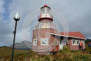 Famous lighthouse at Cape Horn - the southernmost point of the archipelago of Tierra del Fuego, washed by the waters of the Drake