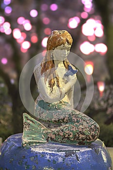 Famous Little Mermaid inspired by Hans Christian Andersen`s book under the cherry blossoms of Asukayama Park in the night of Kita