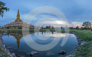 Famous Maha Mongkol Bua Pagoda in Roi-ed Thailand at sunset.