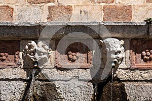 Famous mediaeval Fountain of 99 Spouts in ithe old town of L\'Aquila, Italy