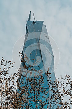 Famous Merdeka 118 skyscraper in Kuala Lumpur against a cloudy sky