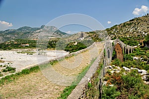 The famous Mesi bridge in Mes, Albania photo