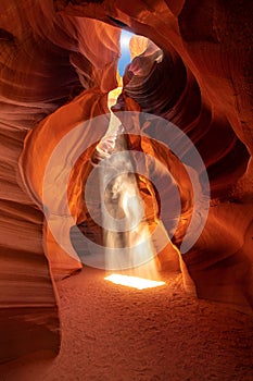 Famous midday sun ray in a slot canyon Antelope. The Navajo reservation, Arizona, USA