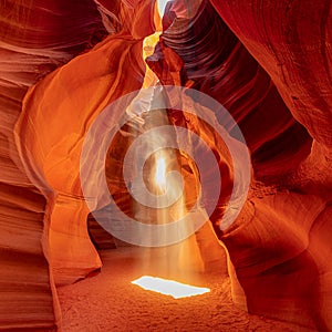 Famous midday sun ray in a slot canyon Antelope. The Navajo reservation, Arizona, USA