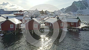 Famous multicolored wooden fishing houses rorbu on a sea shore