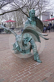 Famous Mystery Author Edgar Allan Poe in the Boston - copper statue - BOSTON , MASSACHUSETTS - APRIL 3, 2017 photo