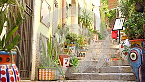 Famous narrow bystreet in Taormina with hand-painted vases on the stairs