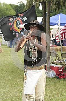 Famous Native American flutist Mike Serna playing his flute at Miami All Nations Gathering at Parke County