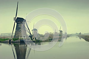 The Famous Netherlands wooden Windmills, UNESCO World Heritage Site, Kinderdijk Windmill village in the soft sunset light of