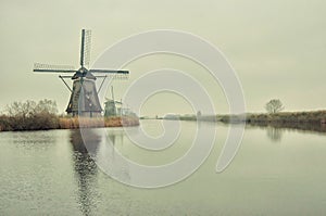 The Famous Netherlands wooden Windmills, UNESCO World Heritage Site, Kinderdijk Windmill village in the soft sunset light of