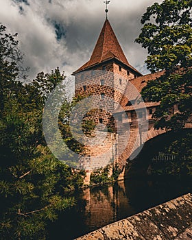 Famous Nurnberg Castle and trees in Germany under a cloudy sky