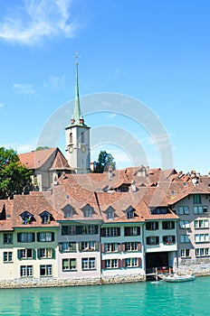 Famous Nydegg Church and historical center of the Swiss capital located along turquoise Aare River. Bern, Switzerland.