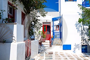 Famous old town narrow street with white houses. Mykonos island, Greece