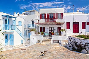 Famous old town narrow street with white houses. Mykonos island, Greece