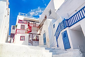 Famous old town narrow street with white houses. Mykonos island, Greece