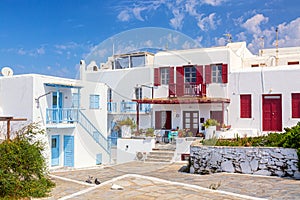 Famous old town narrow street with white houses. Mykonos island, Greece