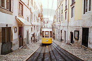 Famous old yellow tram on street of Lisbon, Lisboa.