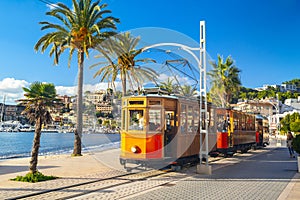 The famous orange tram runs from Soller to Port de Soller, Mallorca, Spain photo