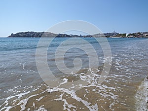 Famous panorama of sandy beach at bay of ACAPULCO city in Mexico with awesome view and waves of Pacific Ocean