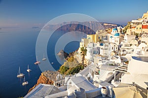 Famous Panoramic view of Santorini, Greece. White architecture, yachts and the blue sea of the island of Santorini against the