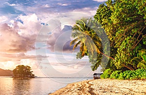 Famous paradise Anse Source d'Argent beach at La Digue in sunset light, Seychelles