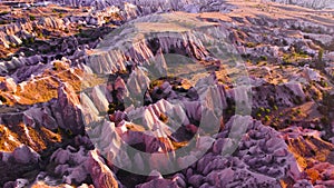 Famous Pink Valley At Sunset, Gulludere in Cappadocia, Turkey. Colourful Mountains, Birds eye view 4k aerial drone