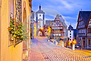 Famous Plonlein gate and cobbled street of historic town of Rothenburg ob der Tauber evening view