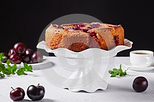 Famous plum torte on a cake stand