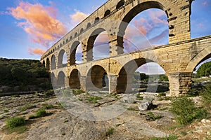 Famous Pont du Gard at sunset, old roman aqueduct in France
