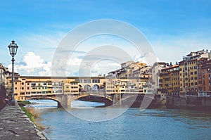 Famous Ponte Vecchio Bridge, medieval stone bridge over the Arno River in Florence, Tuscany, Italy. Major landmark of the Italian